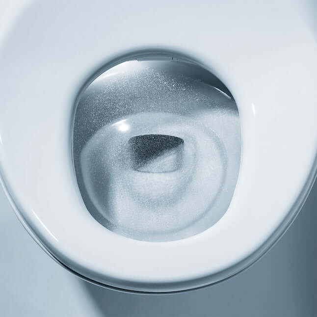 Close-up view of the TOTO Neorest NX1 smart bidet toilet bowl, showcasing its modern design and dual flush system.