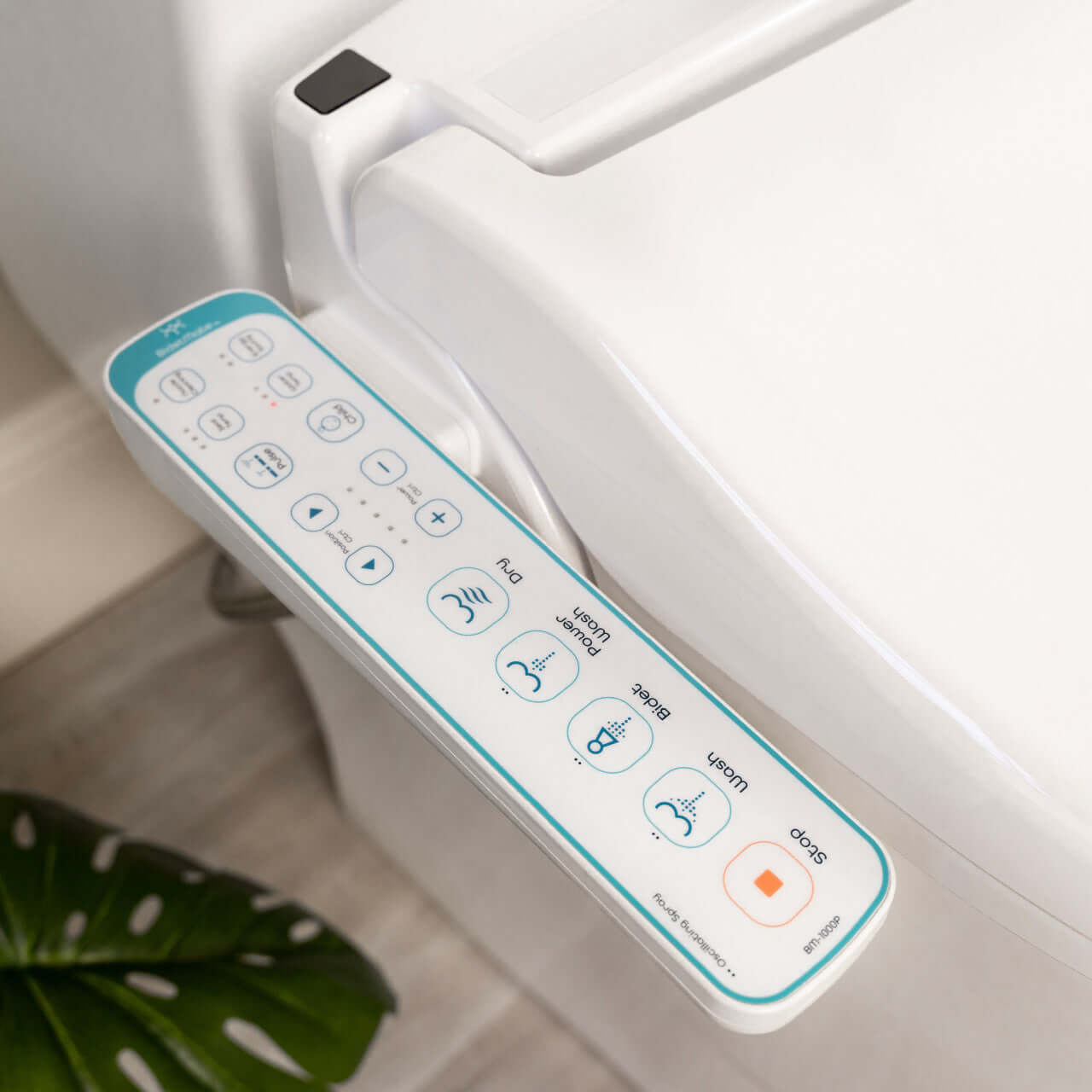 Close-up of BidetMate 1000 Series smart bidet toilet seat control panel with customizable wash functions.