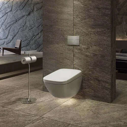 Wall mounted toilet with nightlight shining on floor underneath