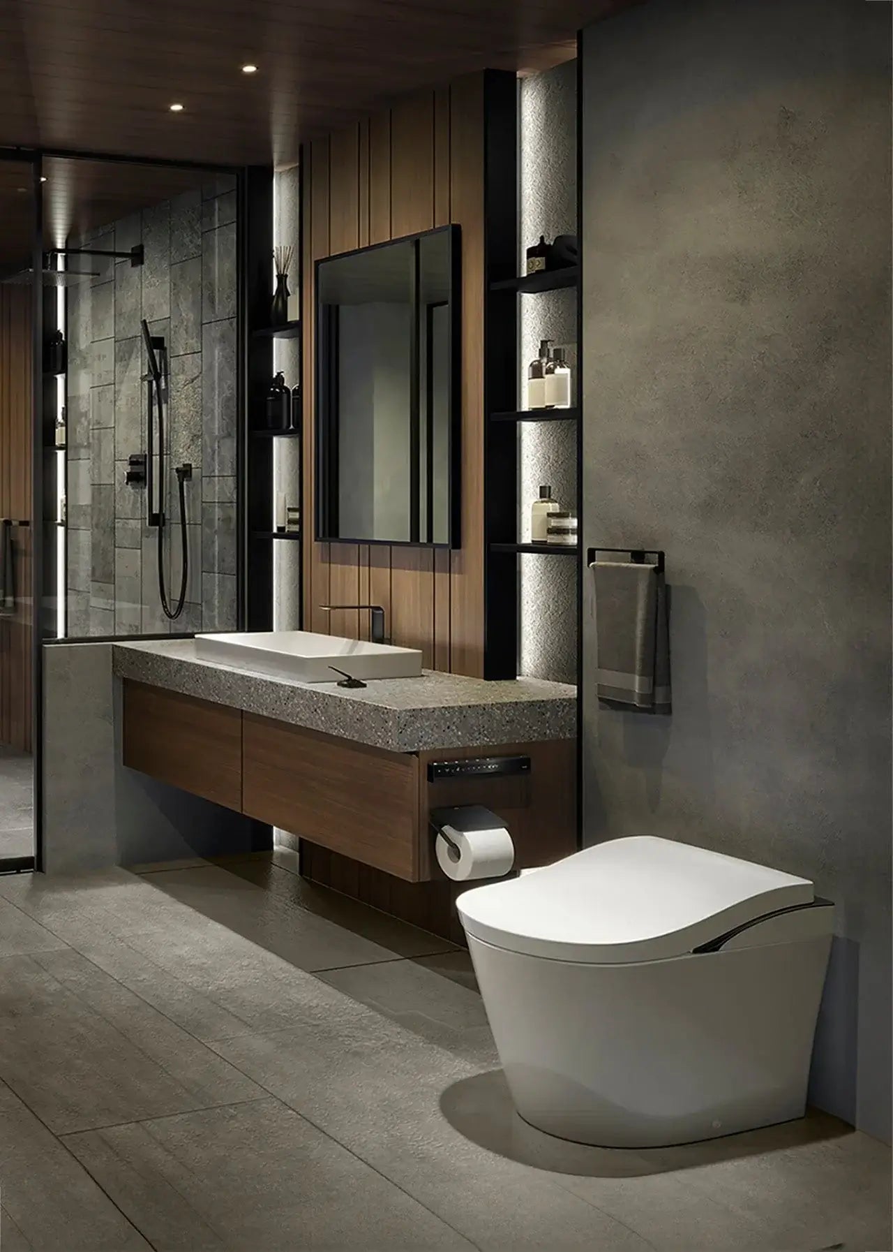 Modern bathroom with a toilet, sink, and mirror mounted on the wall.