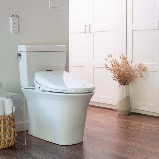 Brondell Swash 1400 Luxury Smart Bidet Toilet Seat in a modern bathroom setting with plants and natural light.