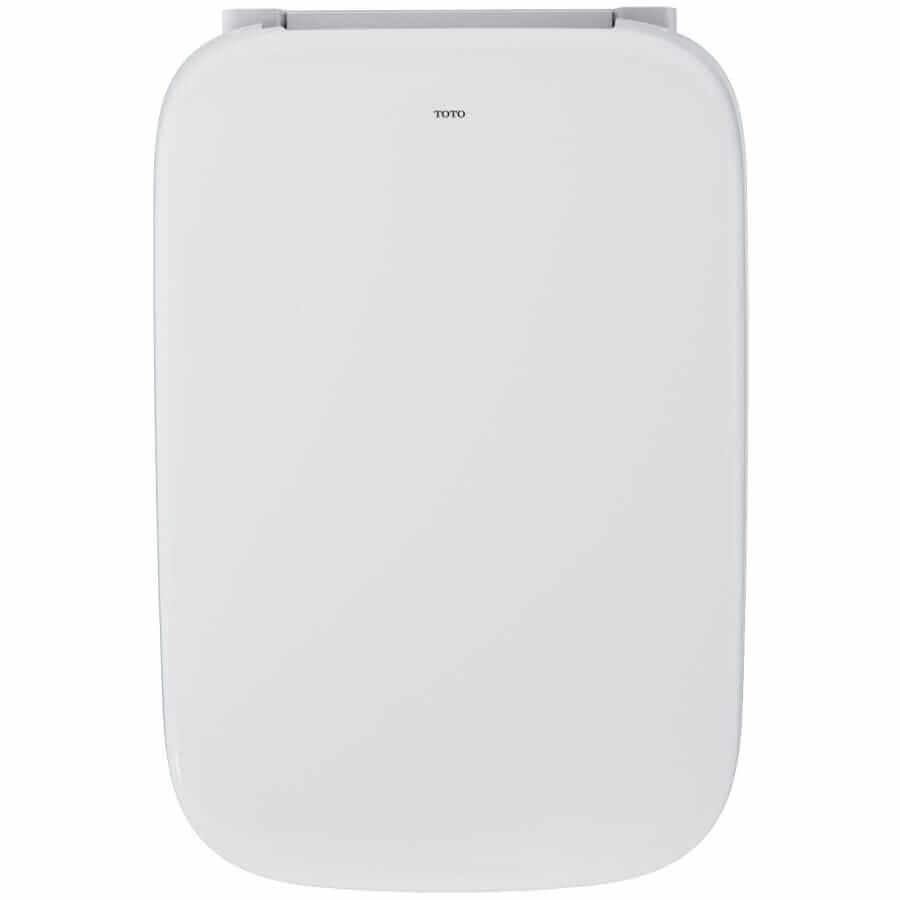 Looking down on the toilet with the lid closed from above with white background