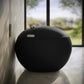 Swiss Madison Plaisir Round Smart Bidet Toilet with modern design and smart features against a window backdrop.