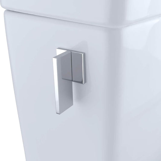 Chrome toilet handle on a white toilet tank