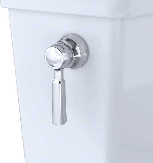 Chrome toilet flush handle on a white toilet tank