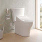 Modern toilet in a bathroom with a chevron-patterned wall and window.