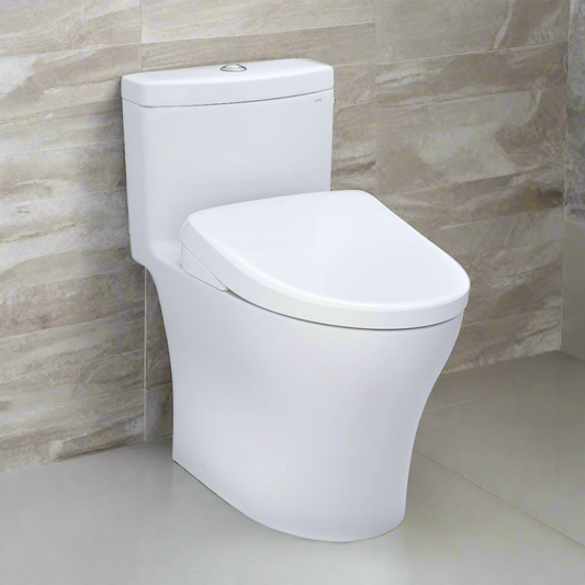 White toilet against a beige tiled wall