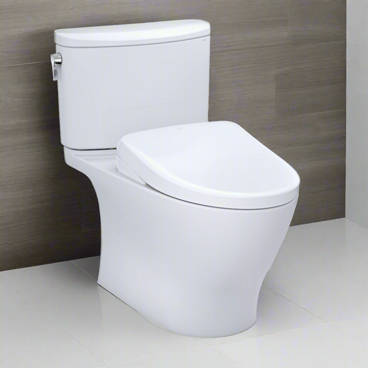 White toilet against a gray wall in a bathroom setting